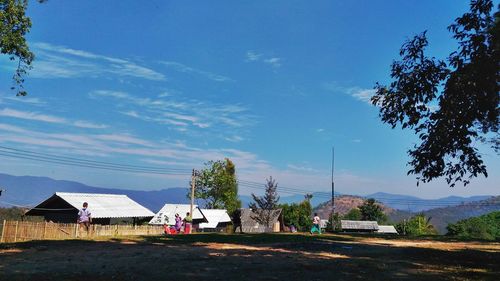 Scenic view of landscape against blue sky