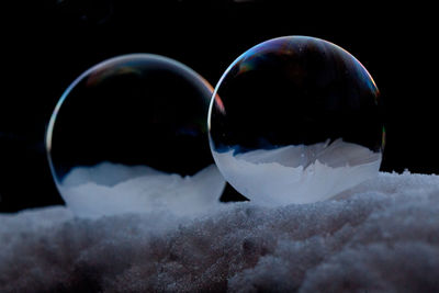 Close-up of ice against black background