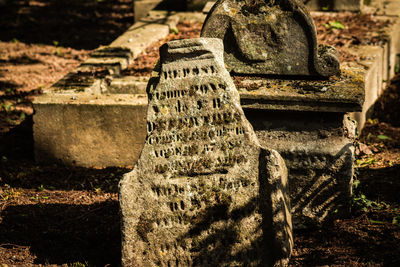 Close-up of cross at cemetery