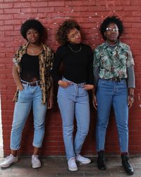 Portrait of friends standing outdoors