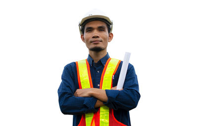 Young man standing against white background