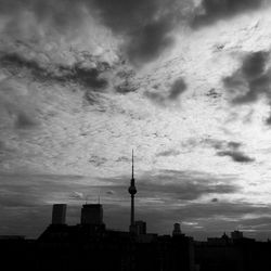 City skyline against cloudy sky