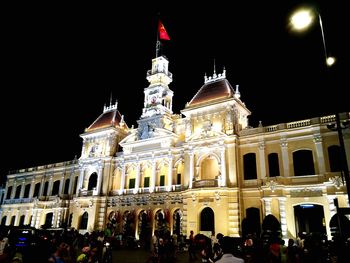 Low angle view of tourists at night