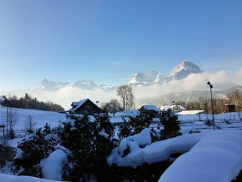 Scenic view of snow covered mountains