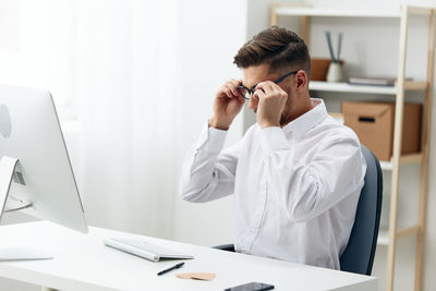 Businessman working at desk in office