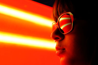 Close-up portrait of woman wearing sunglasses