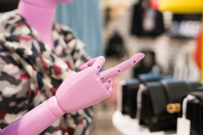 Close-up of mannequin showing middle finger at store