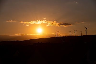 Scenic view of silhouette landscape against sky during sunset