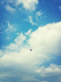 Low angle view of airplane flying in sky