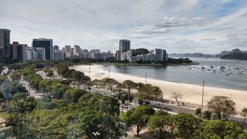 Scenic view of sea and buildings against sky