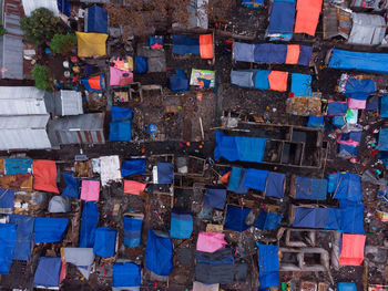 Multi colored umbrellas hanging on street in city