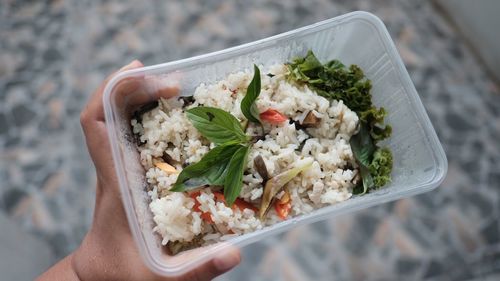 High angle view of person holding food