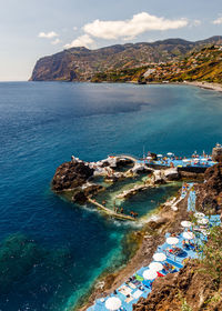 High angle view of bay and sea against sky