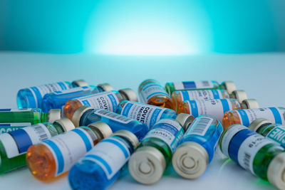 Close-up of multi colored bottles on table
