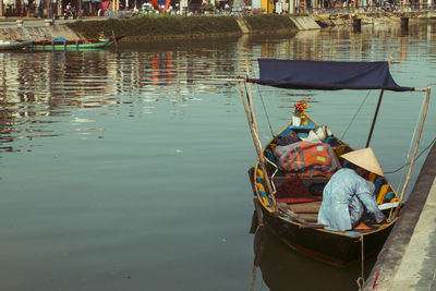 High angle view of fishing boat moored in lake