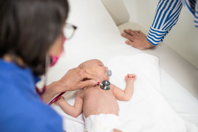 Close-up of doctor examining patient