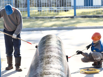 Rear view of man working at construction site