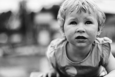 Close-up of cute baby girl looking up