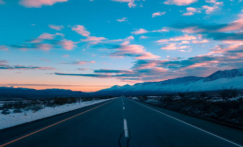 Road against sky at sunset