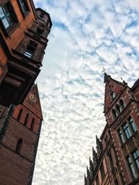 Low angle view of buildings in city against sky