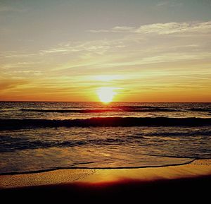 Scenic view of sea at sunset