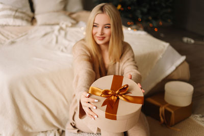 Portrait of smiling young woman at home