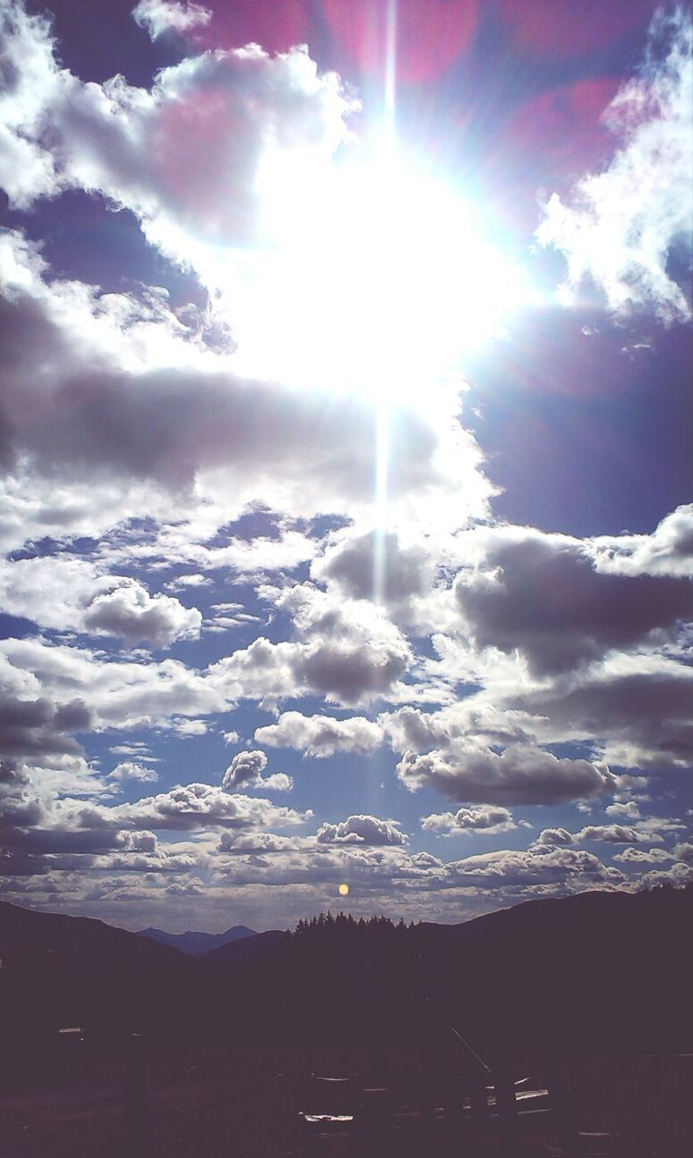 sun, sunbeam, sky, sunlight, cloud - sky, lens flare, tranquility, tranquil scene, beauty in nature, scenics, nature, cloud, sunny, bright, landscape, cloudy, silhouette, low angle view, weather, day