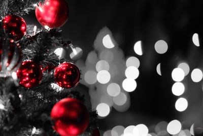 Close-up of christmas decorations hanging on tree