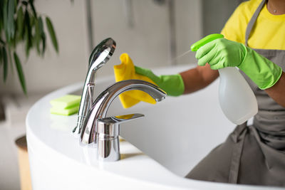 Midsection of man with text in bathroom