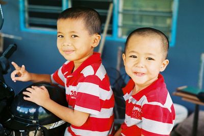 Portrait of boys on motorcycle