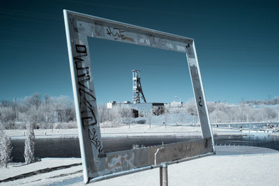 Snow on field against clear sky