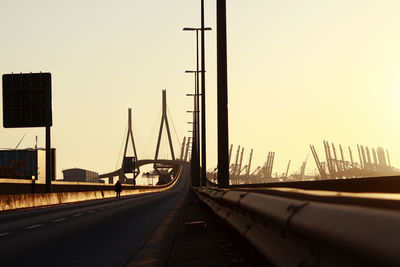 View of bridge over city against clear sky