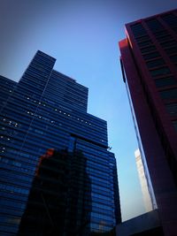 Low angle view of skyscrapers against clear sky