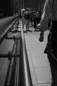 Woman standing by railing