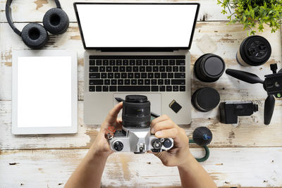 Directly above shot of person using laptop on table