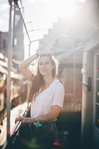 Young woman standing in balcony