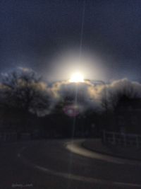 Close-up of road against sky at night