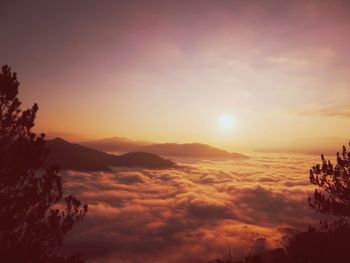 Scenic view of mountains against sky during sunset