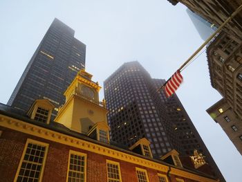 Low angle view of skyscrapers against clear sky