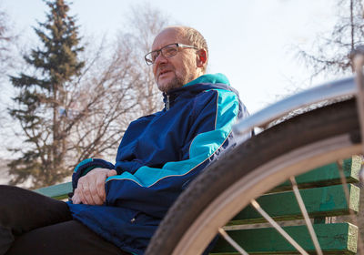 Senior man sitting on bench at park