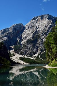 Scenic view of snowcapped mountains against clear blue sky