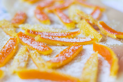 Close-up of orange slice in plate