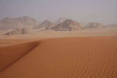 Scenic view of desert against clear sky