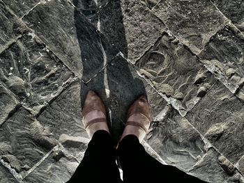 Low section of woman standing on floor