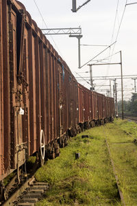 Train on railroad track against sky