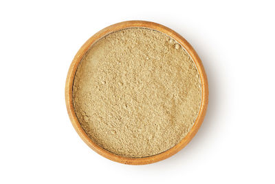 Directly above shot of bread in plate against white background