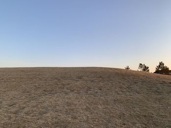 Scenic view of desert against clear sky