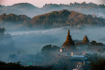 High angle view of trees and buildings against sky