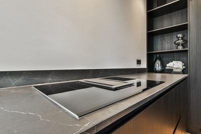 Glass-ceramic stove top in modern kitchen at home
