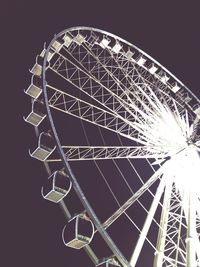 Low angle view of ferris wheel against sky